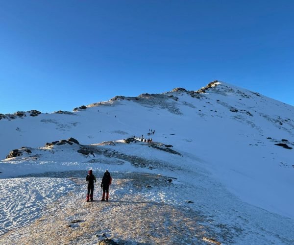 people walking on snow covered ground during daytime